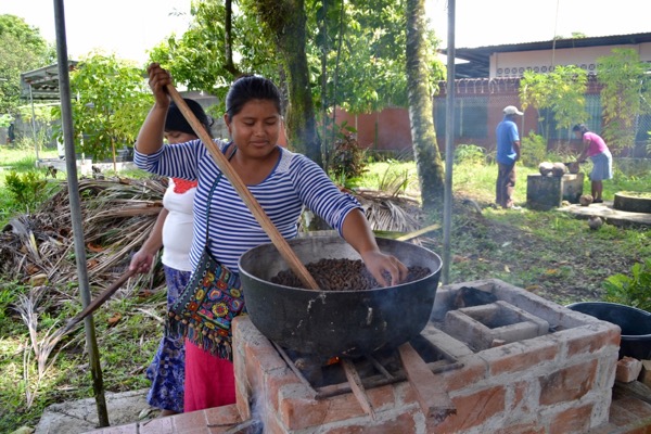 woman roasting cacao panama
