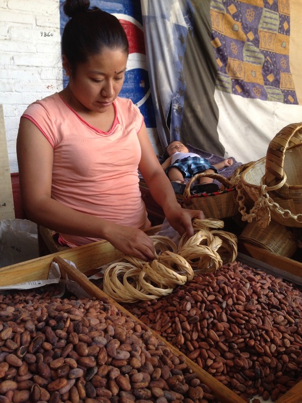 woman selling cacao beans
