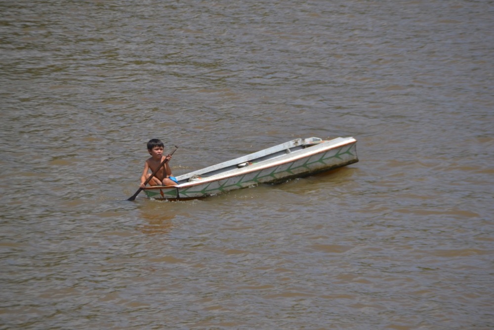 child in a boat on the Amazon River
