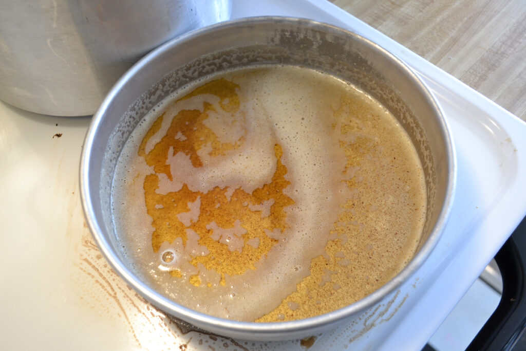 melted butter in a cake pan