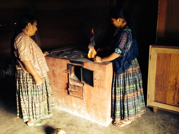 two women roasting cacao