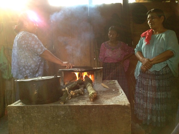 women roasting cacao