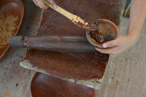 making chocolate on a metate