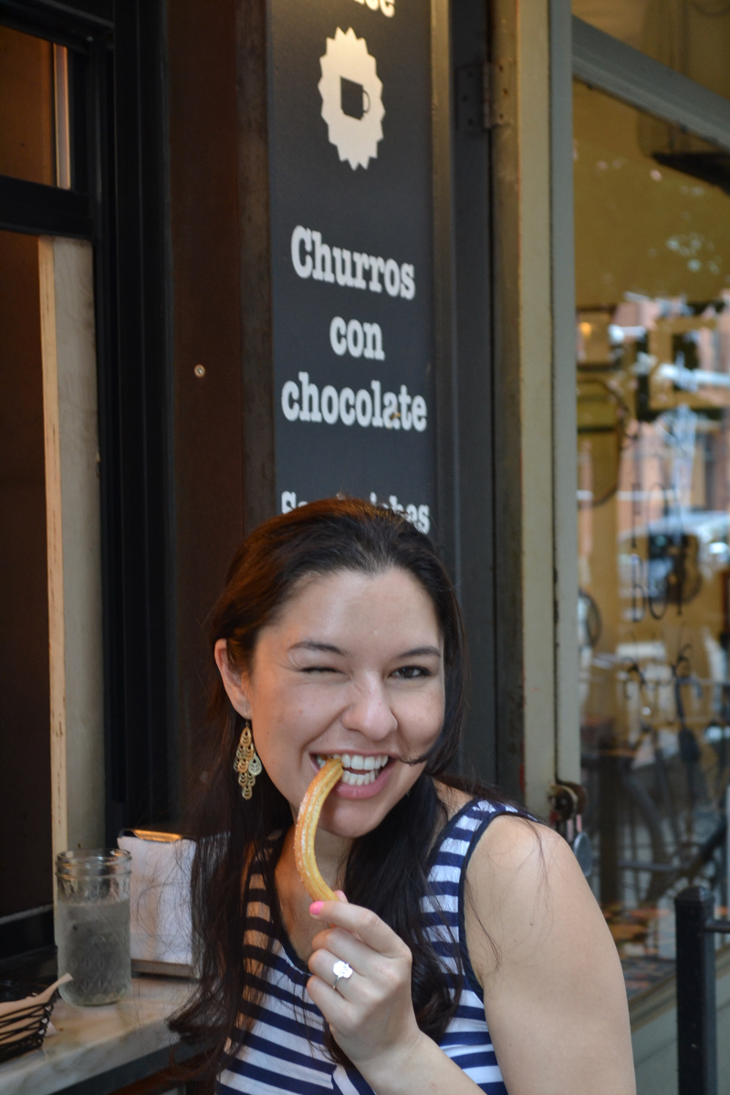 girl eating churros in NYC