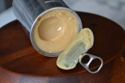 opened can of sweetened condensed milk caramelized