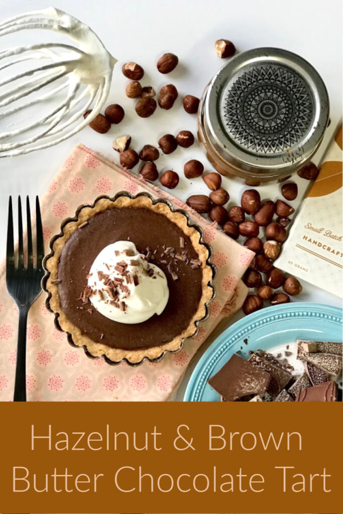 Hazelnuts, chocolate tart, whipped cream, whisk 