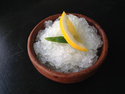 lemon slice, jalapeno and ice in a bowl 