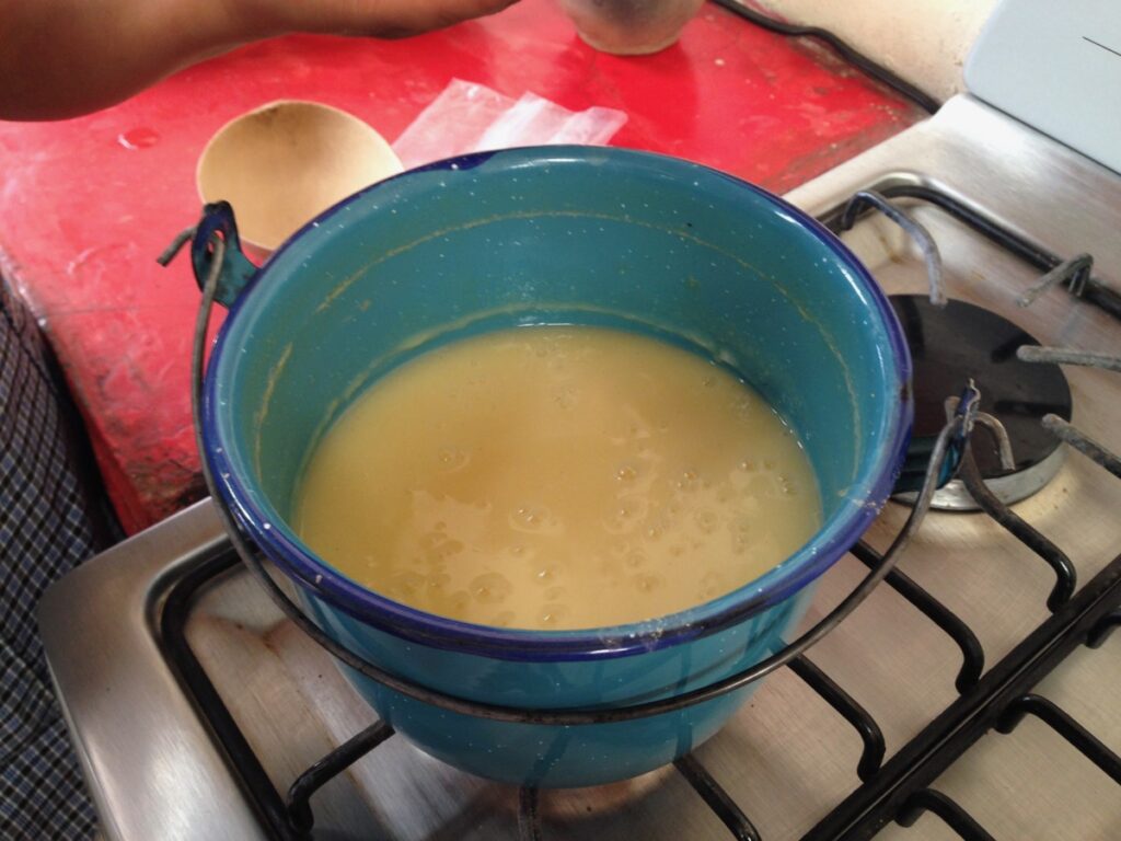 Yellow atole cooking 