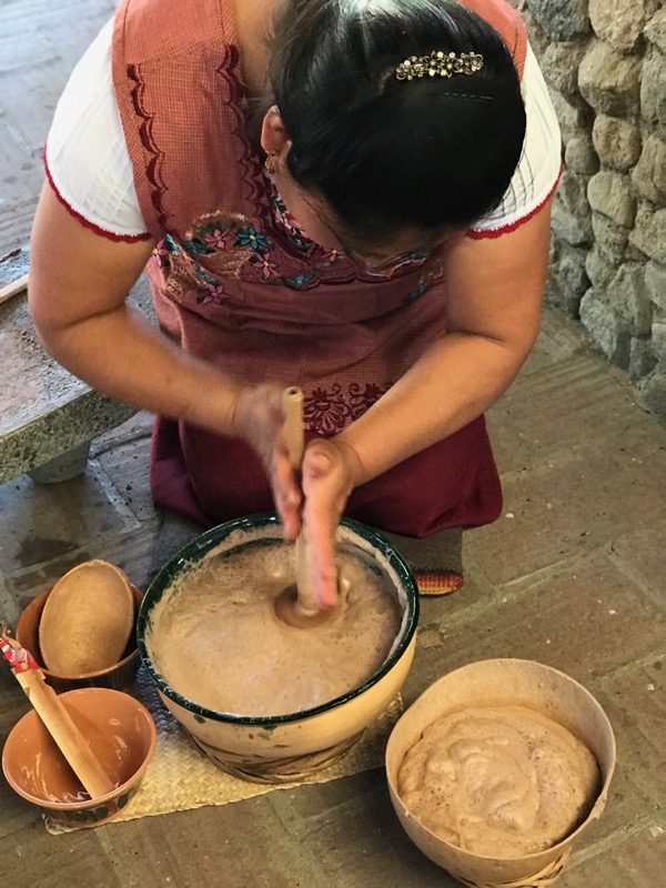 woman mixing chocolateatole