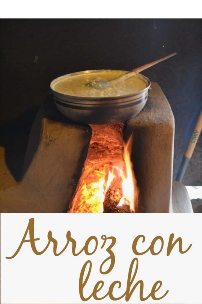 arroz con leche in a pot over clay oven fire