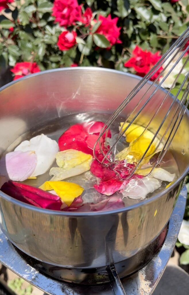 pot of water with rose petals